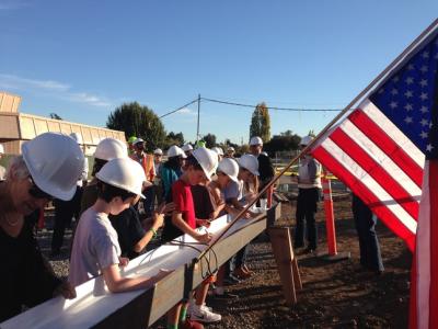 San Carlos: School kids help with 'topping-off' ceremony